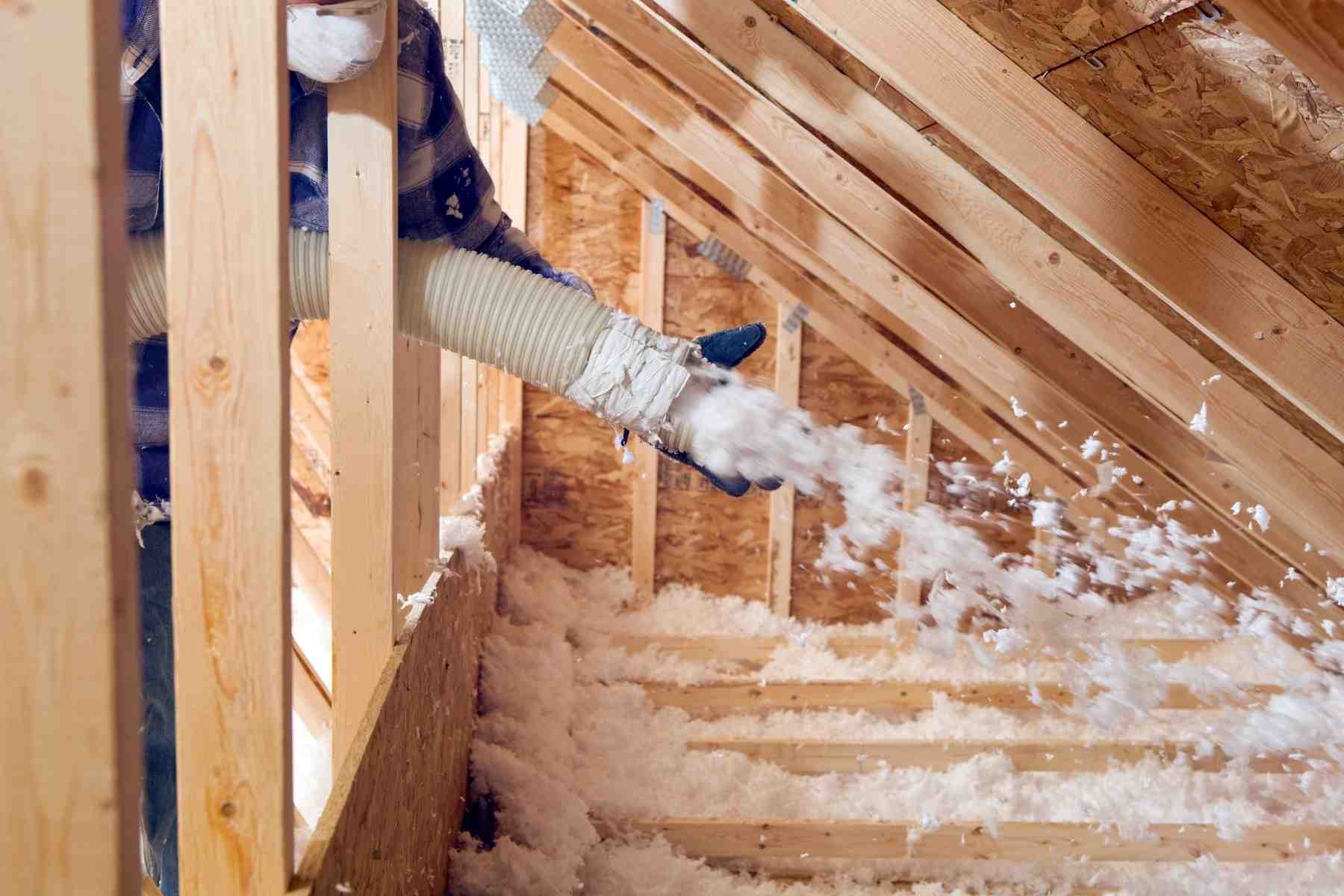 man doing blown insulation lubbock